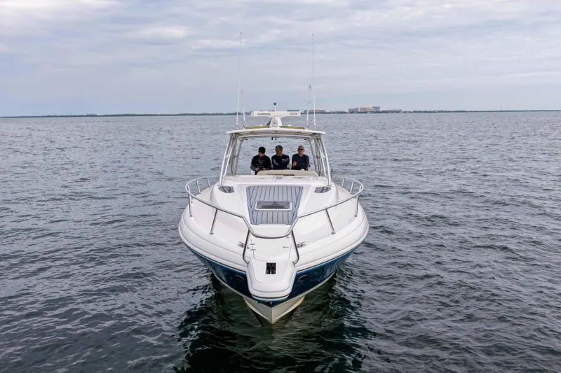 Slide: The Image of 2003 Intrepid 377 Walkaround boat cruising on open water. - 6