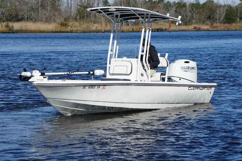 Slide: The Image of 2022 Clearwater 2100 Baystar boat on water with Suzuki engine. - 9