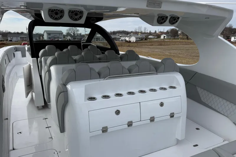 Slide: The Image of 2023 Mystic Powerboats M5200 interior with luxurious seating and modern design. - 11