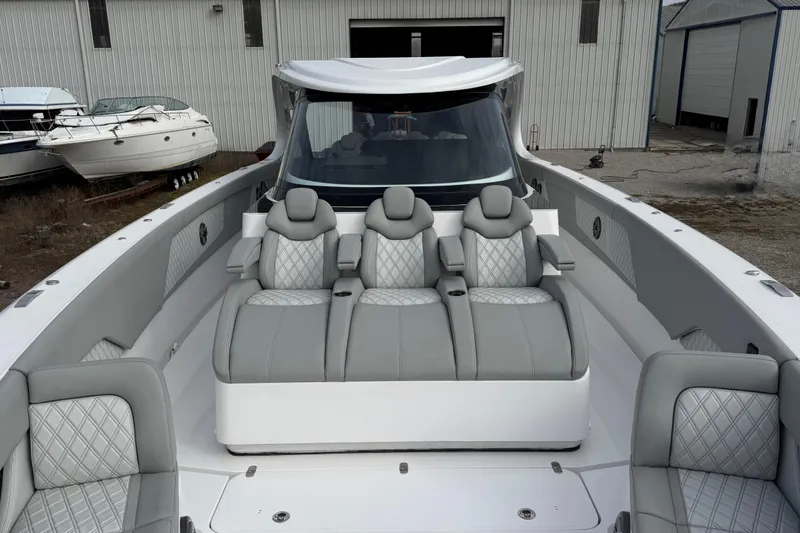 Slide: The Image of 2023 Mystic Powerboats M5200 luxury seating with modern design and elegant upholstery. - 17