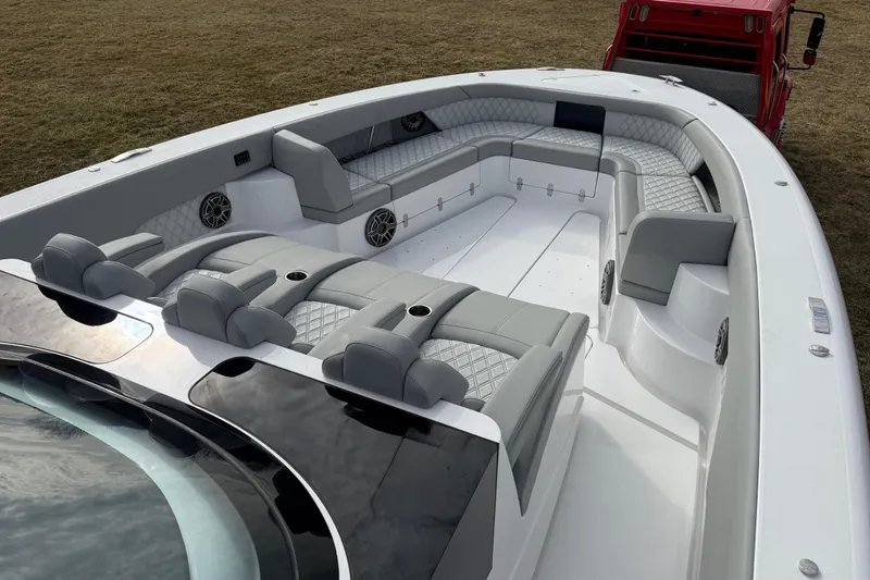 Slide: The Image of 2023 Mystic Powerboats M5200 interior with luxurious seating and modern design. - 24