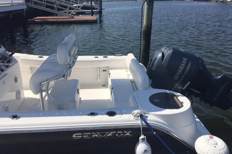 Slide: The Image of 2013 Sea Fox 226 Commander boat with Yamaha engine docked at marina. - 9