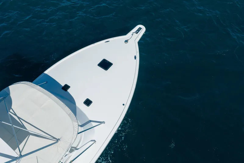 Slide: The Image of Bow of 1997 Strike 42 Express boat on open water. - 10