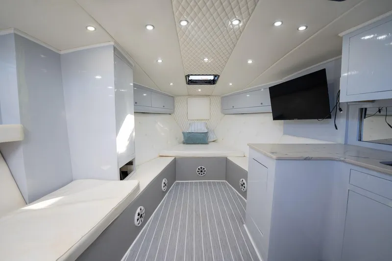 Slide: The Image of Luxurious interior of 1997 Strike 42 Express boat with modern amenities and elegant design. - 13