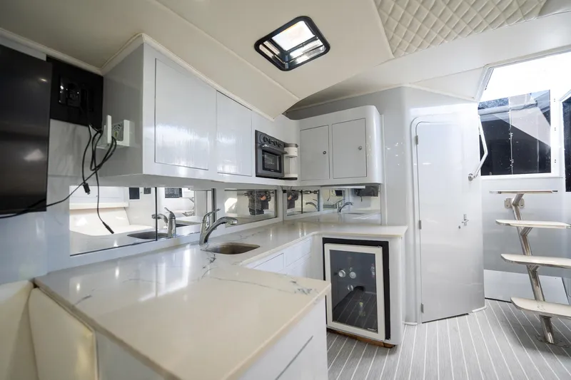 Slide: The Image of Luxurious 1997 Strike 42 Express yacht interior with modern kitchen and sleek design. - 15