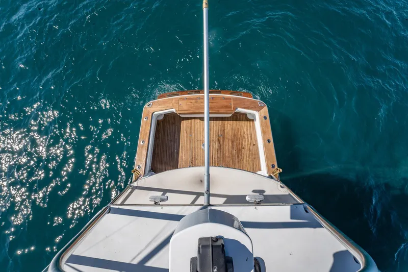 Slide: The Image of Aerial view of 1997 Strike 42 Express boat deck on sparkling blue water. - 24