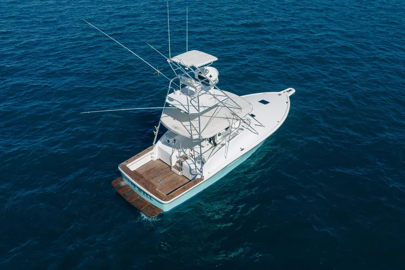 Slide: The Image of Aerial view of 1997 Strike 42 Express yacht on open blue sea. - 5