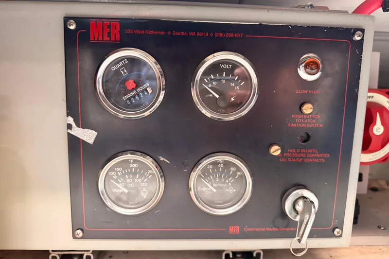 Slide: The Image of Control panel of a 1965 Custom Trawler with gauges and ignition switch. - 28