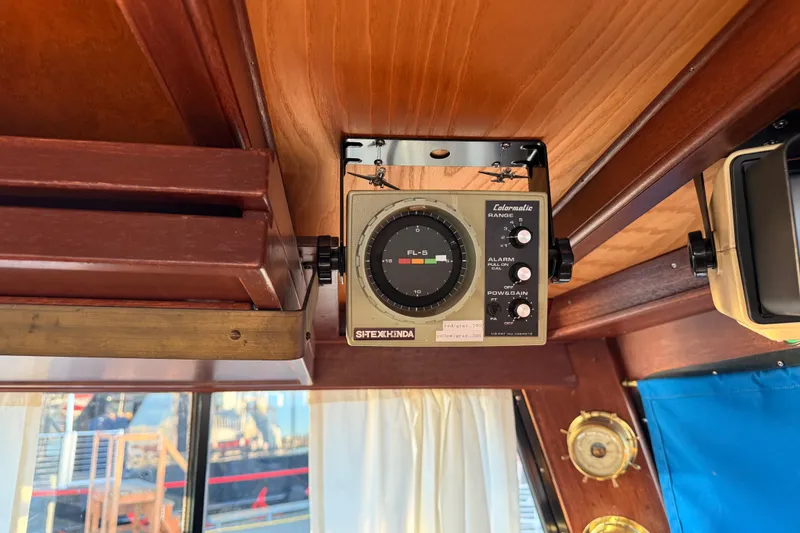 Slide: The Image of Vintage 1965 Custom Trawler interior with marine navigation equipment. - 30