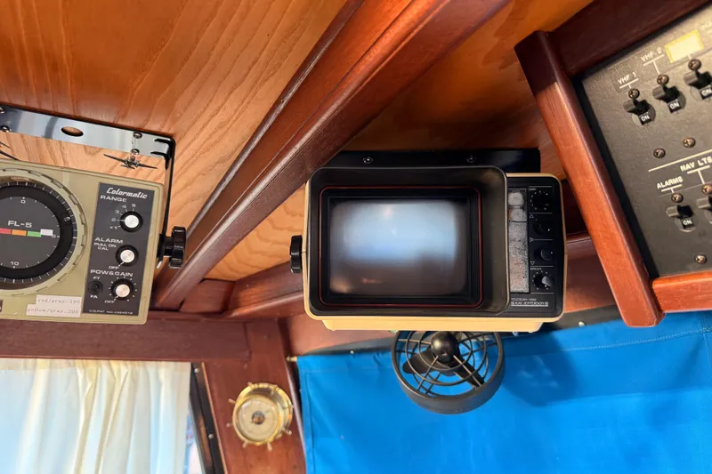 Slide: The Image of 1965 Custom Trawler interior with vintage navigation equipment and control panel. - 31