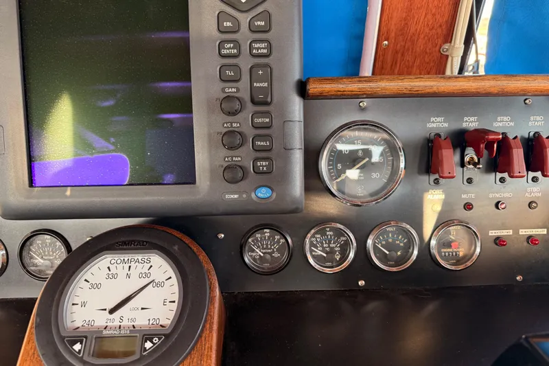 Slide: The Image of Control panel of a 1965 Custom Trawler with navigation instruments and gauges. - 34