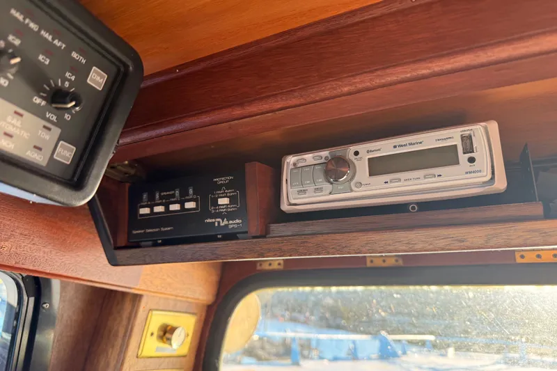 Slide: The Image of 1965 Custom Trawler interior with West Marine audio system and control panel. - 37