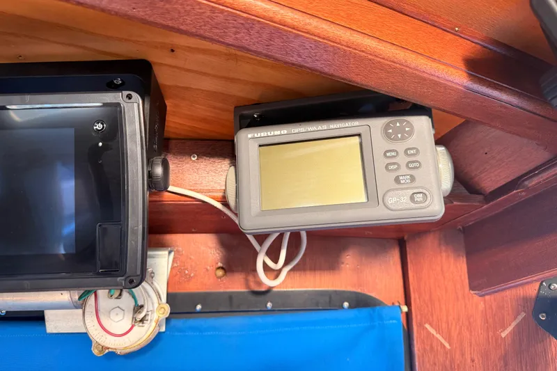 Slide: The Image of 1965 Custom Trawler interior with Furuno GPS navigator and control panel. - 41