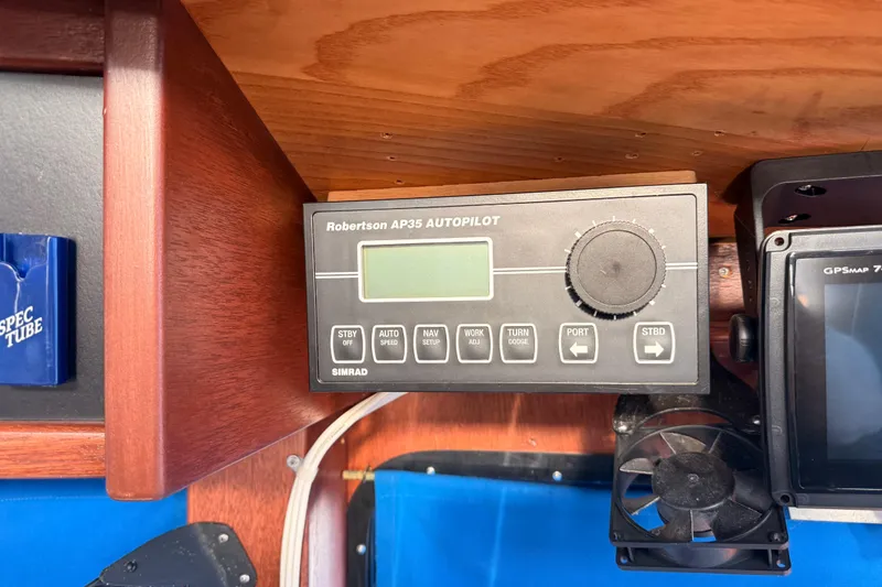 Slide: The Image of Robertson AP35 autopilot system on 1965 custom trawler, featuring control panel and navigation equipment. - 43