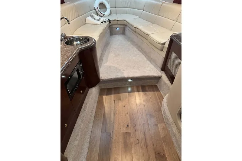 Slide: The Image of Luxurious interior of 2003 Formula 400 Super Sport yacht with plush seating and wood flooring. - 10