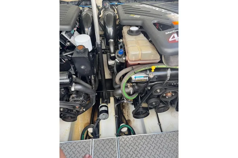 Slide: The Image of Engine compartment of a 2003 Formula 400 Super Sport boat with MerCruiser components. - 12
