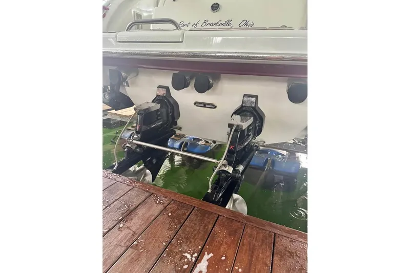 Slide: The Image of Rear view of 2003 Formula 400 Super Sport boat with dual outboard motors. - 13