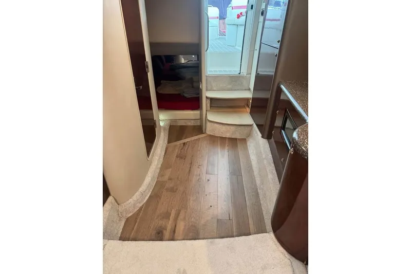 Slide: The Image of Interior of 2003 Formula 400 Super Sport yacht with wood flooring and carpeted steps. - 8