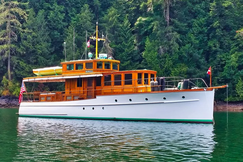 The Image of Classic 1926 Hacker-Craft Bridge Deck yacht on calm water. - 0