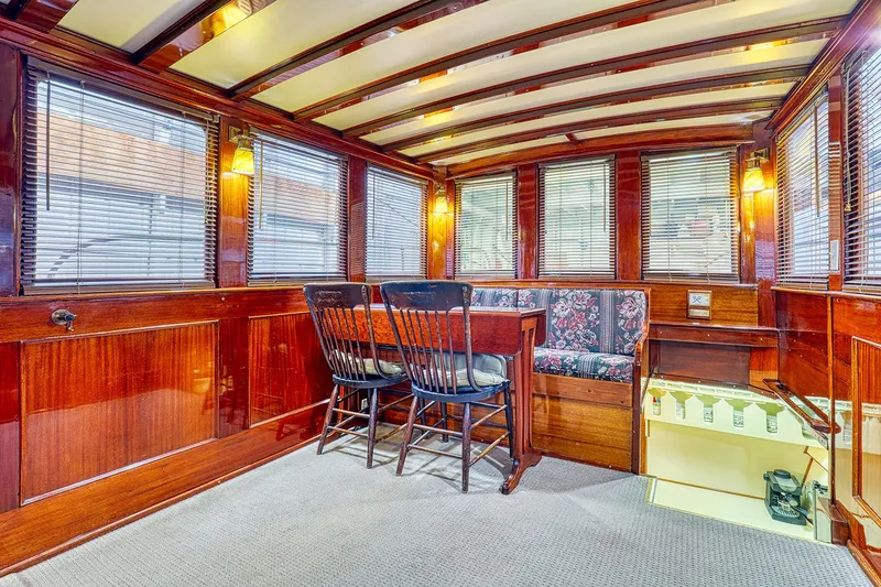 Slide: The Image of Interior of a 1926 Hacker-Craft Bridge Deck boat with wooden finish. - 12