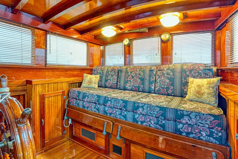 Slide: The Image of Interior of a 1926 Hacker-Craft Bridge Deck boat with wooden furnishings. - 15