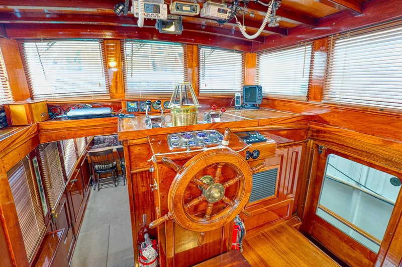 Slide: The Image of Interior of a 1926 Hacker-Craft Bridge Deck boat with wooden paneling. - 16