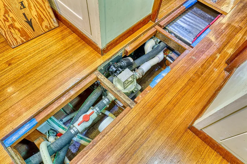 Slide: The Image of Interior view of 1926 Hacker-Craft Bridge Deck with exposed pipes. - 26