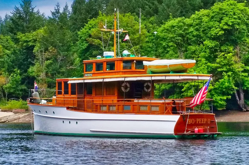 Slide: The Image of 1926 Hacker-Craft Bridge Deck boat on calm water. - 3