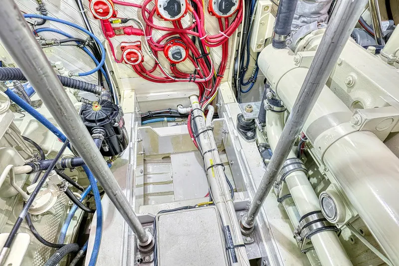 Slide: The Image of Engine room of a 1926 Hacker-Craft Bridge Deck boat, showing cables and machinery. - 30