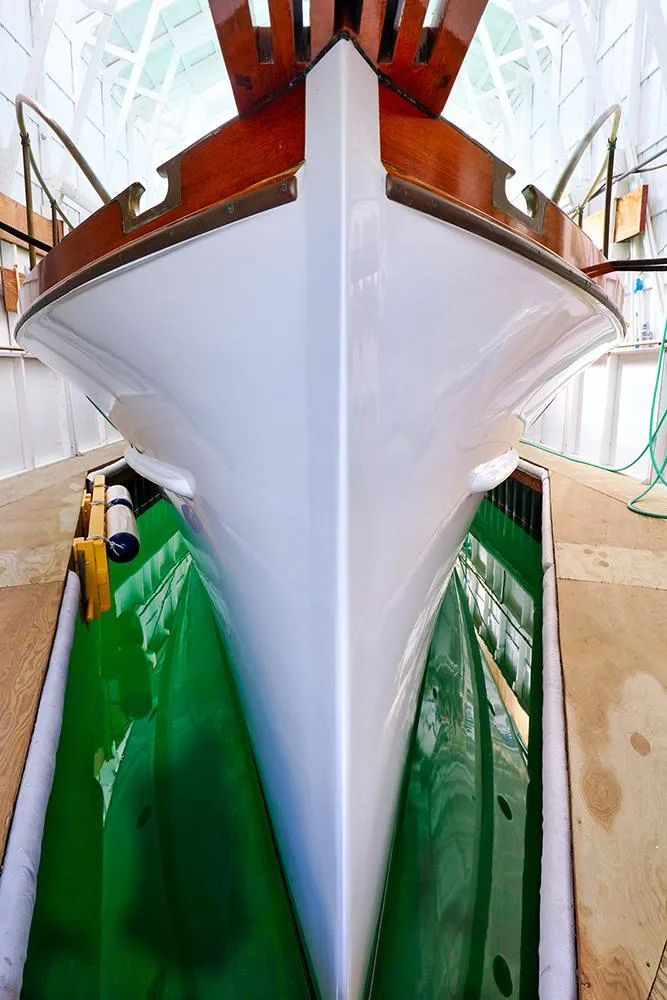 Slide: The Image of 1926 Hacker-Craft Bridge Deck boat in dry dock. - 4