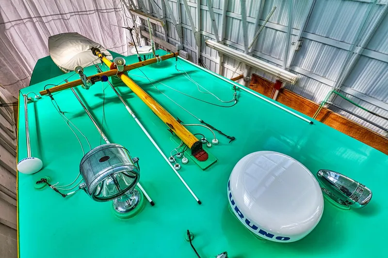 Slide: The Image of 1926 Hacker-Craft Bridge Deck with nautical equipment on green deck. - 7