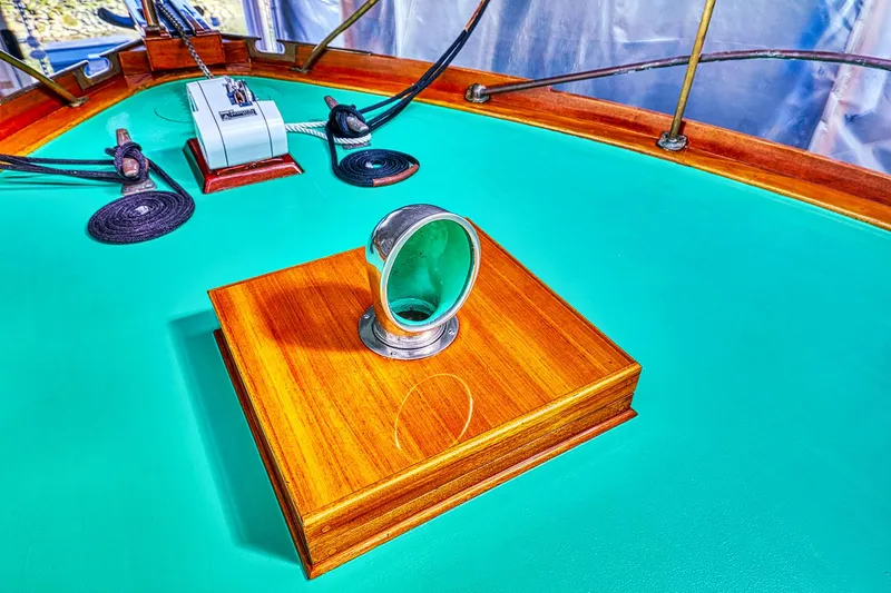 Slide: The Image of 1926 Hacker-Craft Bridge Deck with green surface and wooden accents. - 8