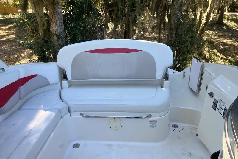 Slide: The Image of 2015 Chaparral 287 SSX boat interior with white and red seating. - 12