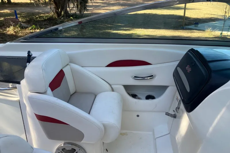Slide: The Image of Interior of 2015 Chaparral 287 SSX boat with white and red seating. - 15