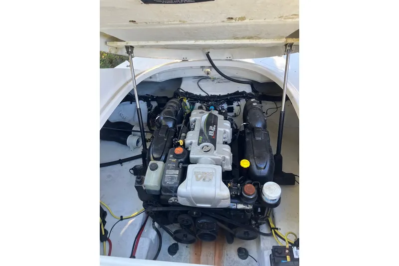 Slide: The Image of Engine compartment of a 2015 Chaparral 287 SSX boat, showcasing the V6 engine. - 21