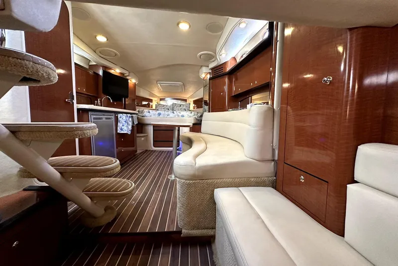 Slide: The Image of Luxurious interior of 2003 Sea Ray 340 Sundancer yacht with elegant wood finishes. - 17