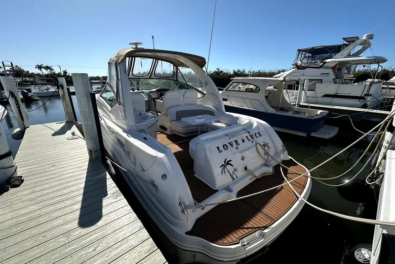 Slide: The Image of 2003 Sea Ray 340 Sundancer docked at marina, sunny day, luxury boat. - 2