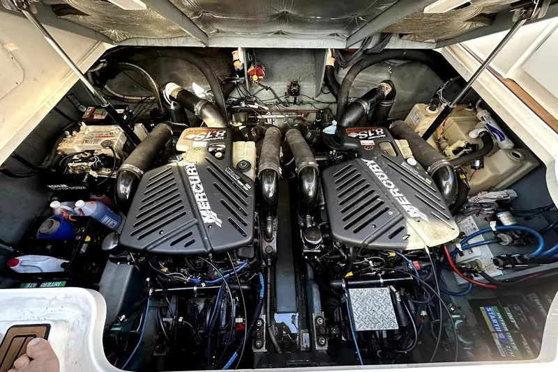 Slide: The Image of Engine compartment of a 2003 Sea Ray 340 Sundancer with twin Mercury engines. - 23