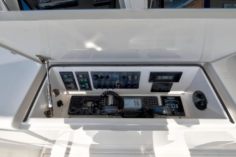 Slide: The Image of 2008 Viking Convertible boat control panel with communication and navigation equipment. - 11