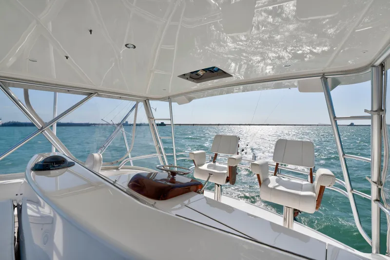 Slide: The Image of 2008 Viking Convertible yacht helm with ocean view and luxurious seating. - 13
