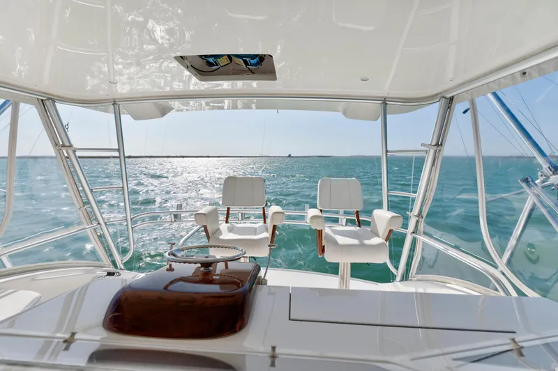 Slide: The Image of 2008 Viking Convertible yacht interior with ocean view and captain's chairs. - 15