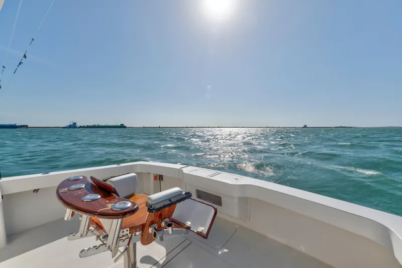 Slide: The Image of 2008 Viking Convertible yacht deck overlooking sunny ocean waters. - 20