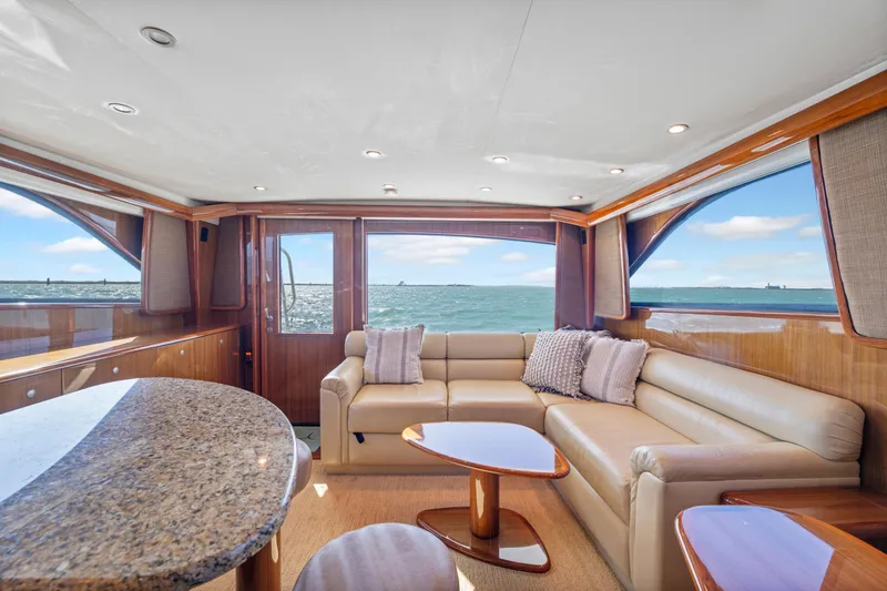 Slide: The Image of Luxurious interior of a 2008 Viking Convertible yacht with ocean view and elegant furnishings. - 23