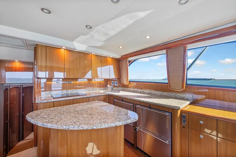 Slide: The Image of Luxurious 2008 Viking Convertible yacht kitchen with granite countertops and ocean view. - 24