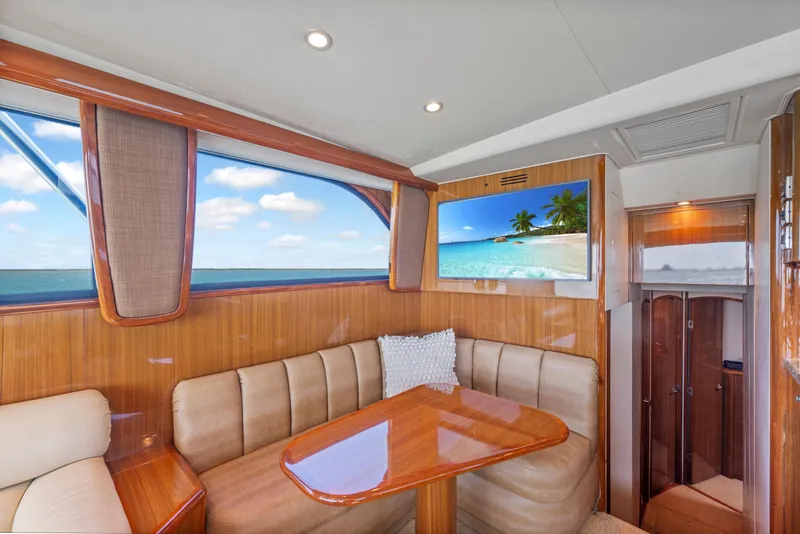 Slide: The Image of Luxurious interior of 2008 Viking Convertible yacht with plush seating and scenic window view. - 26