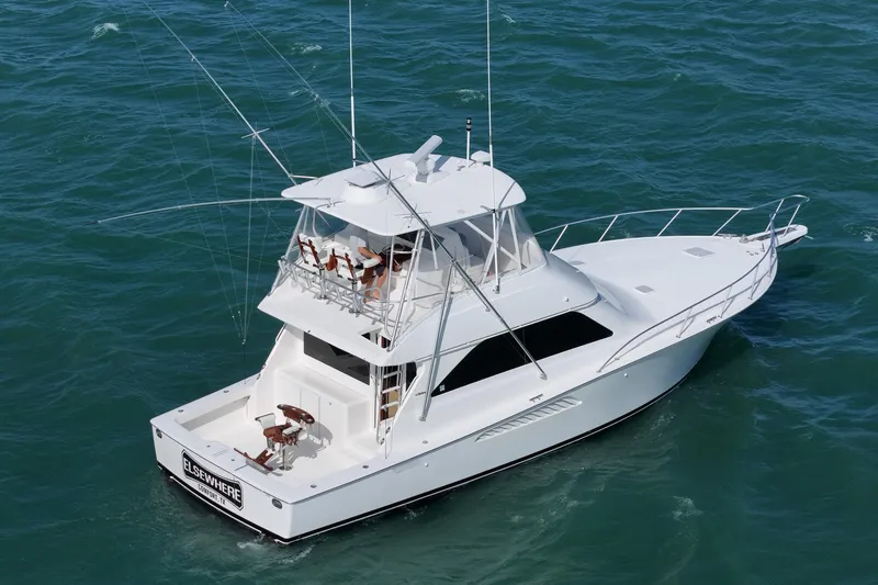 Slide: The Image of 2008 Viking Convertible yacht cruising on open water, featuring sleek design and fishing equipment. - 3