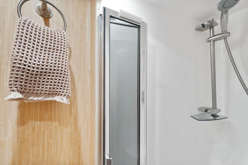 Slide: The Image of Modern shower with glass door and towel in 2008 Viking Convertible yacht bathroom. - 33