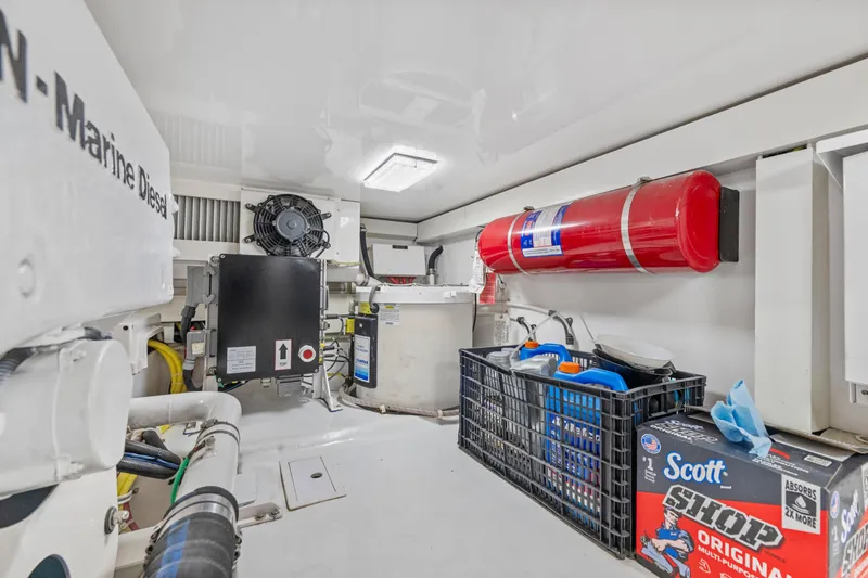 Slide: The Image of Engine room of 2008 Viking Convertible yacht with equipment and storage. - 40