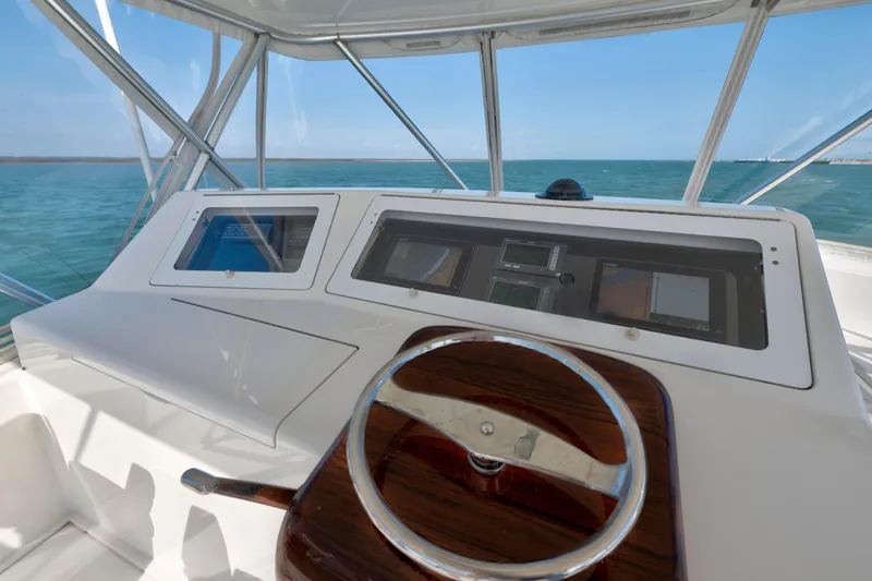 Slide: The Image of 2008 Viking Convertible yacht helm with modern navigation equipment and ocean view. - 7