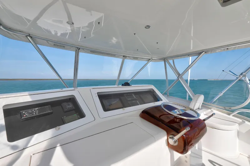 Slide: The Image of 2008 Viking Convertible yacht helm with ocean view and modern navigation equipment. - 8